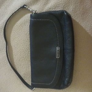 Black mini wristlet Leather with a metalic teal interior Coach purse